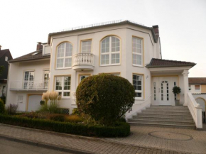 Отель Ferienwohnungen Damm  Казель